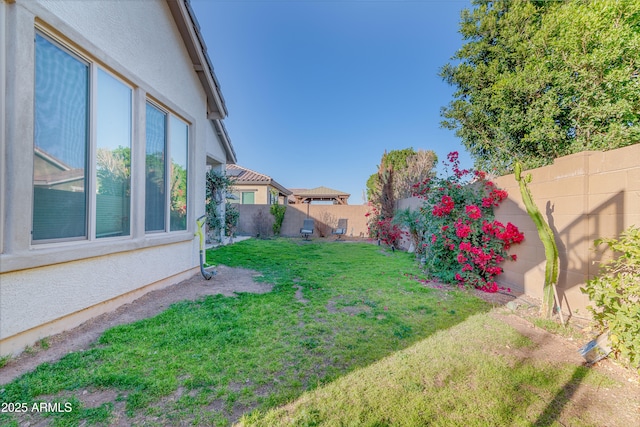 view of yard featuring a fenced backyard