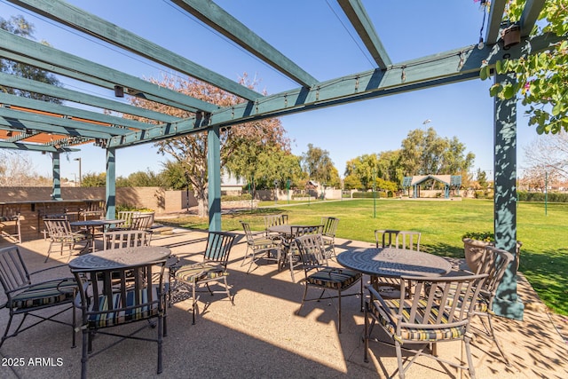 view of patio / terrace with fence, a pergola, and outdoor dining space