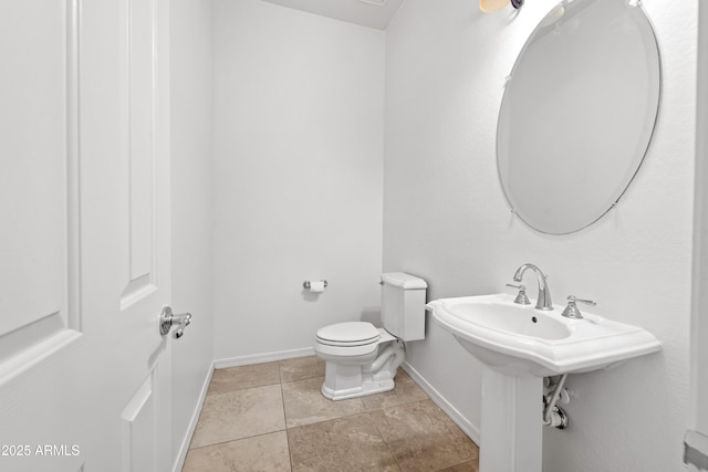 bathroom featuring tile patterned floors and toilet