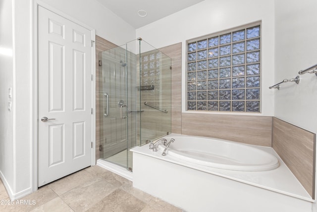 bathroom with shower with separate bathtub