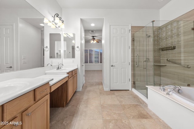 bathroom with vanity, shower with separate bathtub, and ceiling fan