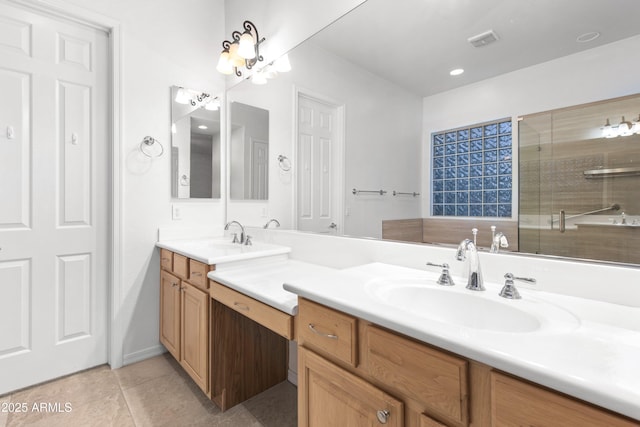 bathroom featuring vanity, tile patterned flooring, and a shower with door