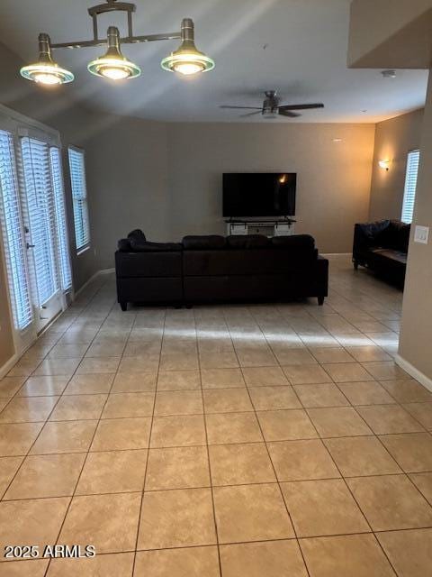 1081 W 1st St Unit 10, Tempe, AZ 85281 - living area with light tile patterned flooring, plenty of natural light, and ceiling fan