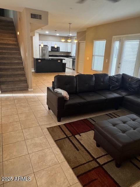 1081 W 1st St Unit 10, Tempe, AZ 85281 - living room with light tile patterned flooring and stairway
