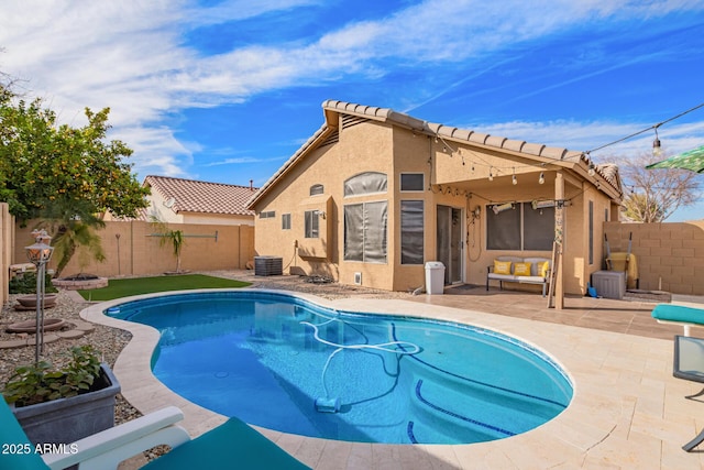 view of pool featuring a patio area, a fenced backyard, central AC unit, and a fenced in pool