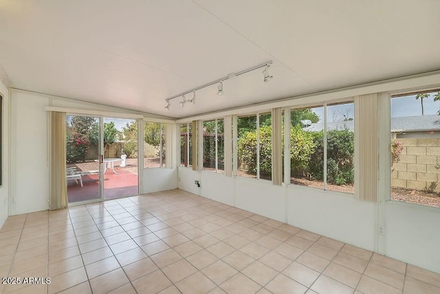 unfurnished sunroom featuring tile patterned flooring