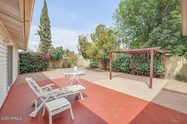 view of patio / terrace with a fenced backyard and a pergola