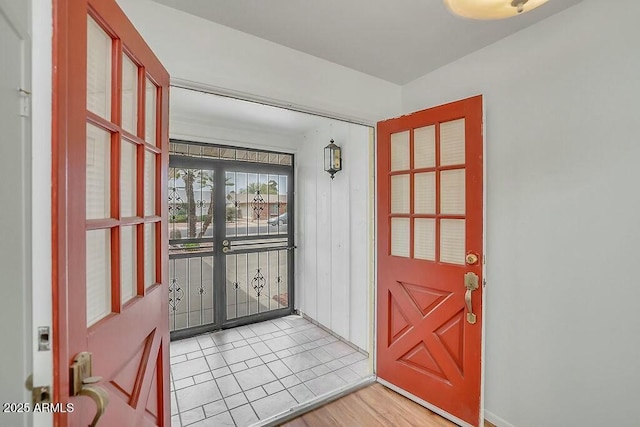 foyer featuring french doors and light wood-style flooring