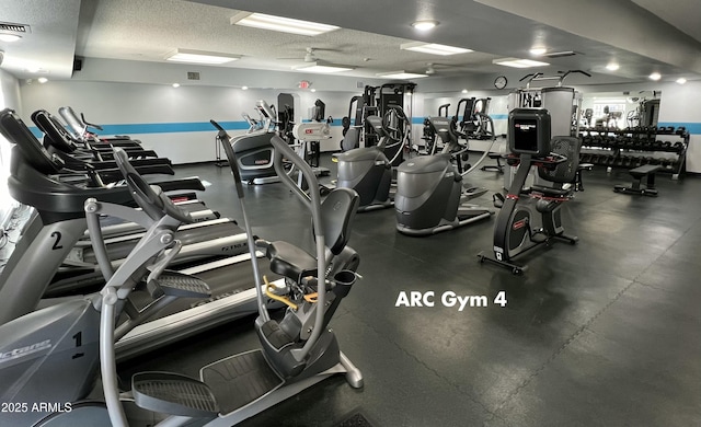 exercise room featuring a textured ceiling and visible vents