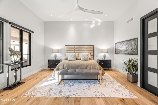 bedroom featuring light hardwood / wood-style floors and ceiling fan