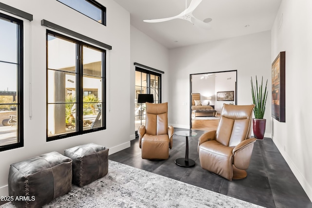 sitting room featuring ceiling fan