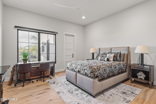 bedroom with hardwood / wood-style floors