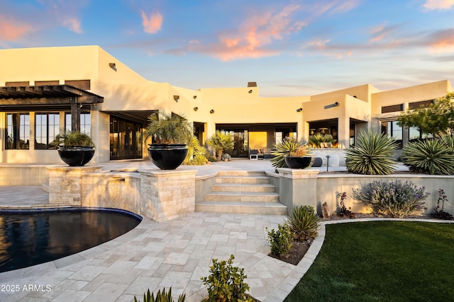 exterior space with a pergola and a patio area