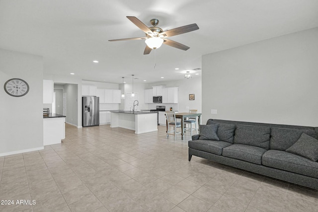 tiled living room featuring ceiling fan