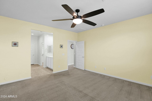 carpeted empty room featuring ceiling fan