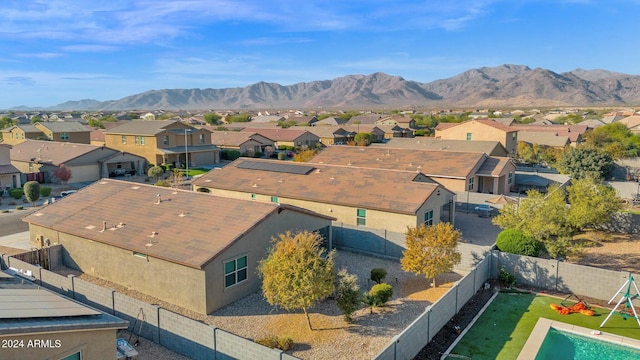 birds eye view of property with a mountain view