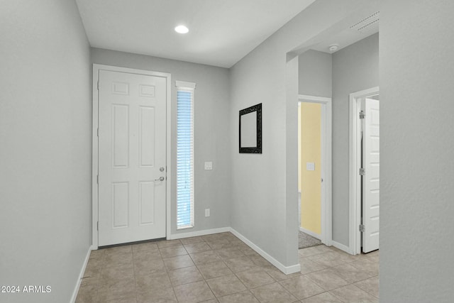 tiled entryway featuring a wealth of natural light