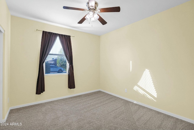 unfurnished room featuring carpet and ceiling fan