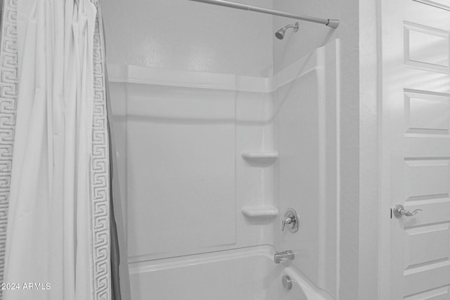 bathroom with shower / bathtub combination with curtain