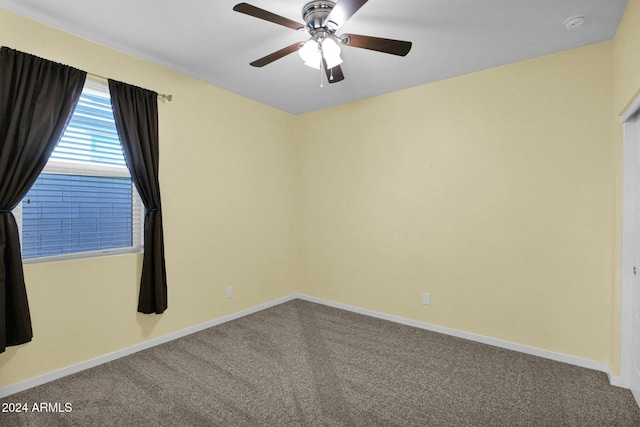 carpeted empty room with ceiling fan