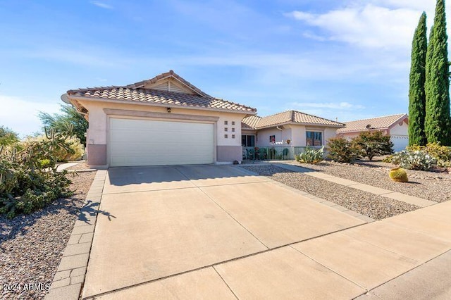 view of front of property with a garage