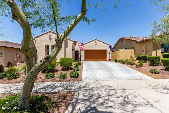 20962 W Thomas Rd, Buckeye, AZ 85396 - mediterranean / spanish house with driveway, stucco siding, an attached garage, and a tile roof