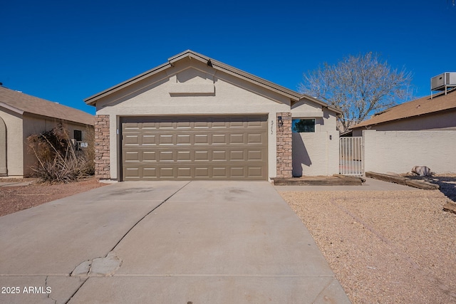 ranch-style home featuring an attached garage, central AC, stone siding, driveway, and stucco siding