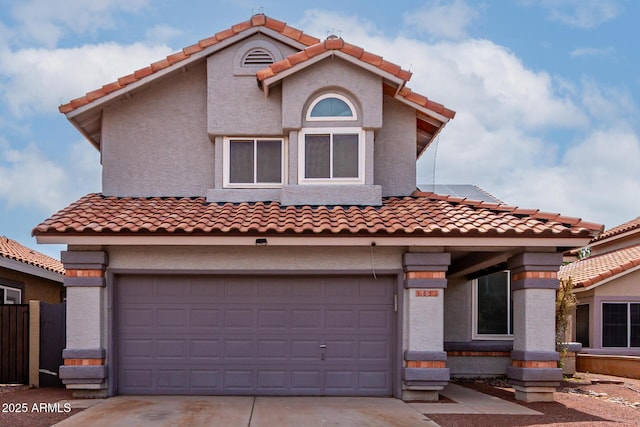 6853 S Roosevelt St, Tempe, AZ 85283 - mediterranean / spanish-style home with driveway, a tiled roof, and stucco siding