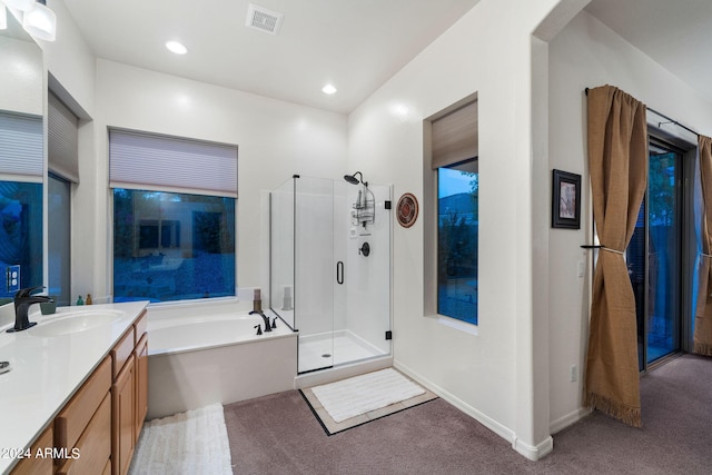 full bath featuring vanity, recessed lighting, a shower stall, a garden tub, and visible vents