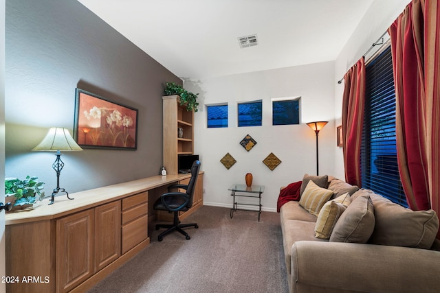home office with built in desk, carpet floors, baseboards, and visible vents