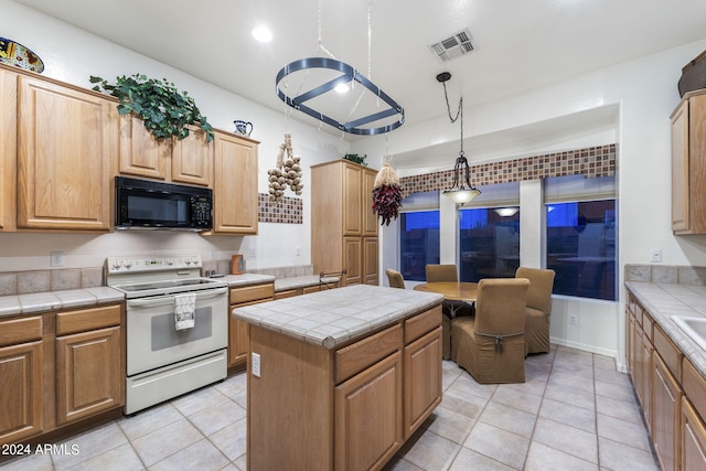 kitchen with tile counters, light tile patterned floors, electric stove, visible vents, and black microwave