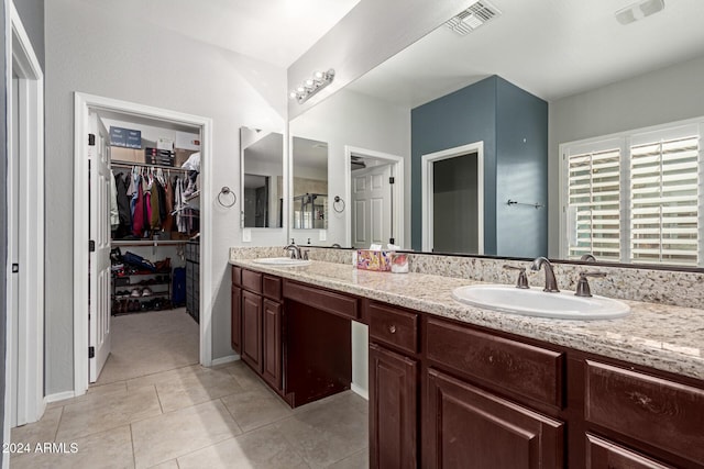 bathroom featuring tile patterned floors and vanity