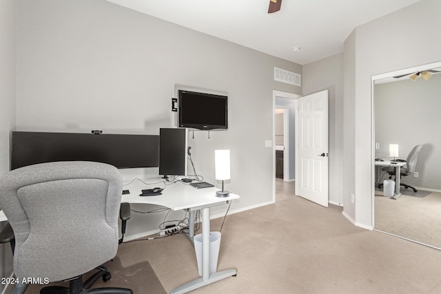 office with light carpet and ceiling fan