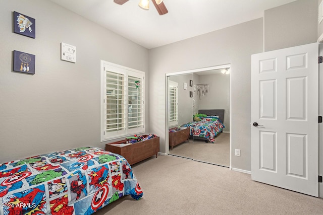 bedroom featuring carpet flooring, ceiling fan, and a closet