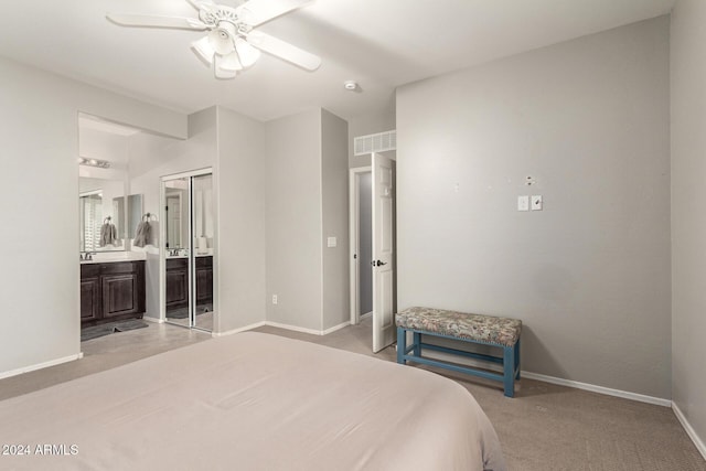 bedroom featuring ceiling fan, a closet, and light colored carpet