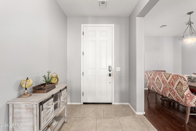 entryway featuring light tile patterned floors