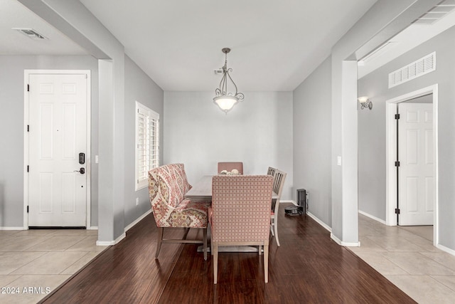 dining space featuring light tile patterned flooring