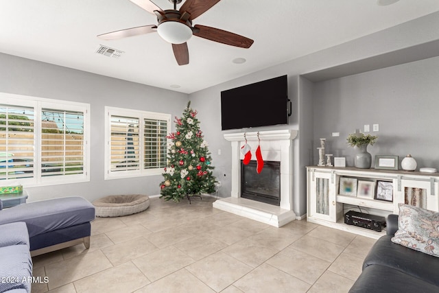 tiled living room with ceiling fan