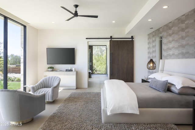 4451 E Joshua Tree Ln, Paradise Valley, AZ 85253 - bedroom featuring recessed lighting, a barn door, a ceiling fan, and concrete floors