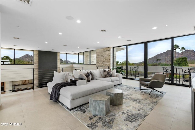 4451 E Joshua Tree Ln, Paradise Valley, AZ 85253 - living area with floor to ceiling windows, recessed lighting, a mountain view, and light tile patterned floors