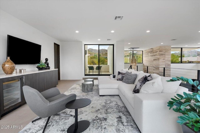 4451 E Joshua Tree Ln, Paradise Valley, AZ 85253 - living room with recessed lighting and a bar