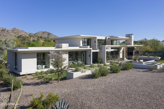 4451 E Joshua Tree Ln, Paradise Valley, AZ 85253 - rear view of property featuring a mountain view, a balcony, and stucco siding