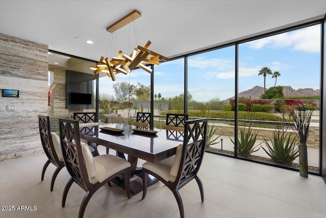 4451 E Joshua Tree Ln, Paradise Valley, AZ 85253 - dining space featuring light tile patterned flooring and a chandelier