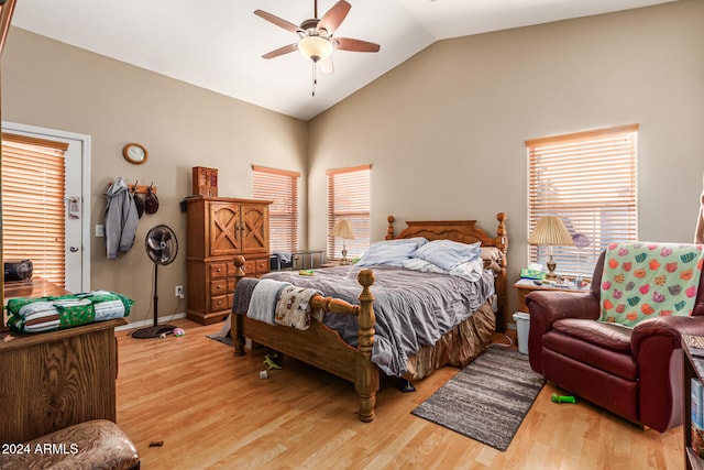 bedroom with light hardwood / wood-style floors, ceiling fan, and lofted ceiling