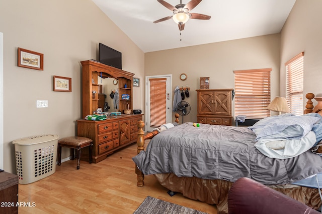 bedroom featuring light hardwood / wood-style flooring, ceiling fan, and lofted ceiling