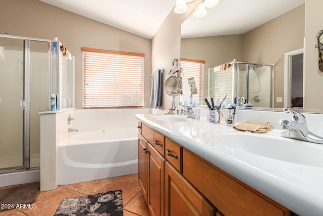 bathroom featuring tile patterned floors, vanity, plus walk in shower, and lofted ceiling