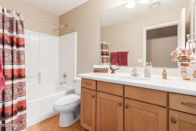 full bathroom featuring tile patterned flooring, shower / bath combo, vanity, and toilet