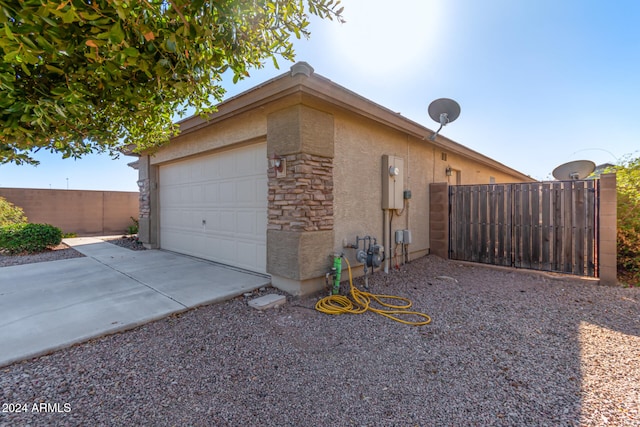 view of side of home with a garage