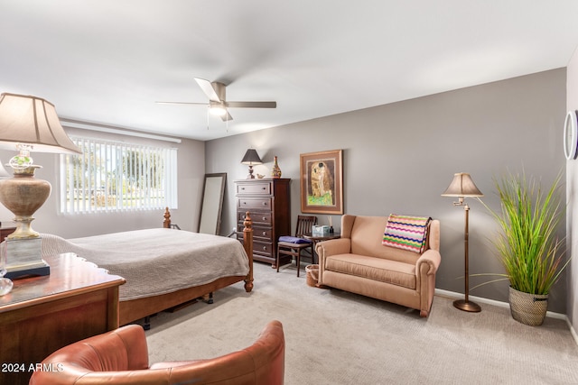 bedroom with ceiling fan and light colored carpet