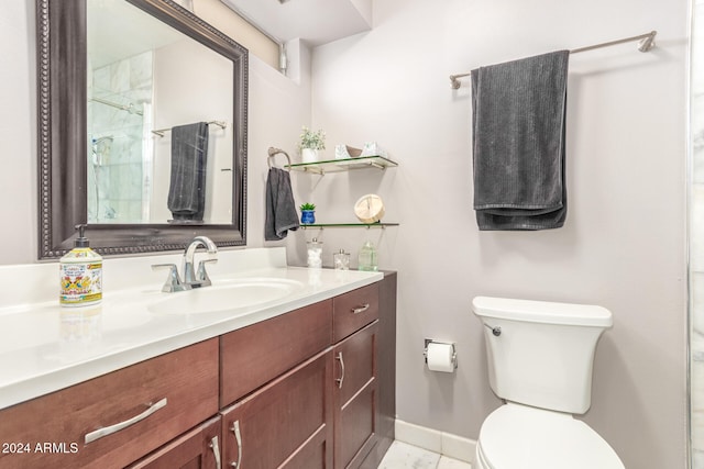 bathroom featuring tile patterned flooring, vanity, and toilet